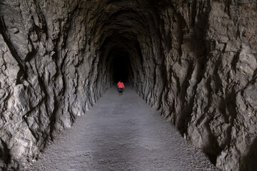 Woman in dark tunnel