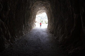 Woman in dark tunnel