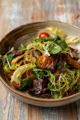 Roasted eggplant salad with mixed greens and cherry tomatoes