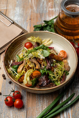 Eggplant salad on a wide rustic plate, country-style photography, top view on a wooden background