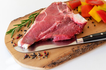 Florentine steak, preparation of raw meat, fillet and sirloin, with spices and peppers, for grilling.