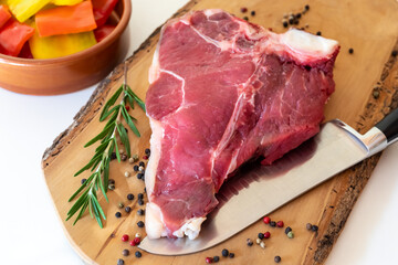 Florentine steak, preparation of raw meat, fillet and sirloin, with spices and peppers, for grilling.