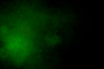 Black magic background with green haze. Abstract wallpaper, background for websites and banners.