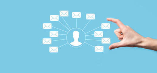Male hand holding letter icon,email icons .Contact us by newsletter email and protect your personal information from spam mail. Customer service call center contact us.Email marketing and newsletter