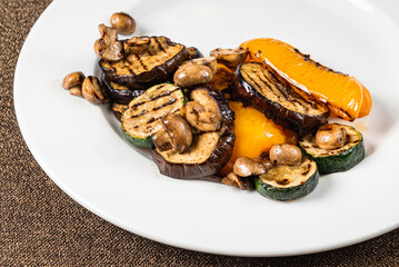 grilled vegetables on the white plate