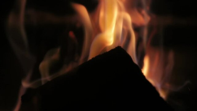 Flames of a fireplace close up slow moton