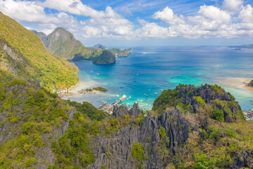 Fototapeta na wymiar Bacuit Bay view from Taraw Cliff, El Nido Palawan. Rocky mountain trropical landscape over azure sea. Aerial drone view.