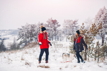 Loving couple walking in a winter park