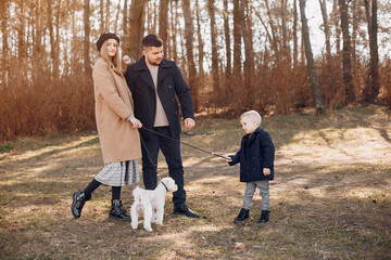 Fototapeta premium Cute family playing in a spring park