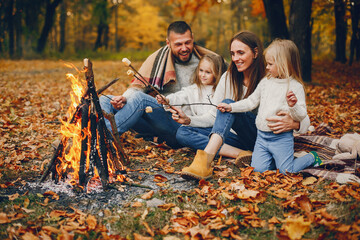Family with cute kids in a autumn park