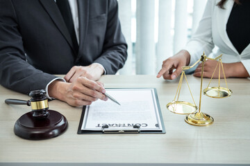 Male lawyer or counselor discussing negotiation legal case with client meeting with document contract in office, law and justice, attorney, lawsuit concept