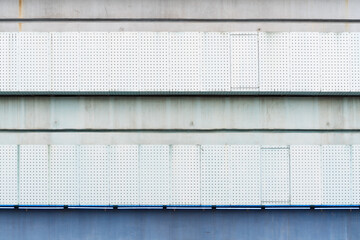 Fototapeta na wymiar lattice wall of a building, lattice made of steel in the area
