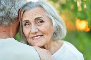 Close up portrait of beautiful senior couple hugging