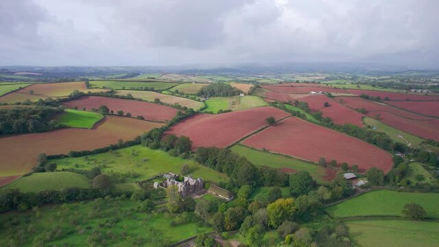 Fields over Compton Castle from a drone, Compton, Devon, England, Europe

