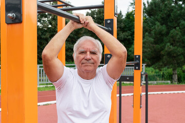 Safe Outdoor Exercises Older Adults senior man male summer, street workout physical Strength activity Calisthenics Park