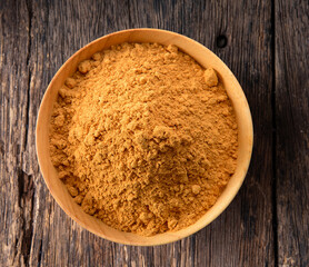 Cinnamon Powder in wood bowl