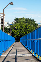 Blue pedestrian bridge with shadows. San Jose, Costa Rica.