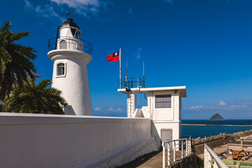 Fototapeta na wymiar Keelung Lighthouse at the west coast of keelung harbor in taiwan