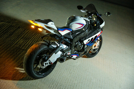 Stupino-Russia - OCTOBER 2, 2021 
motorcycle bmw s1000rr is on concrete floor, night photo