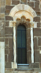 Fototapeta na wymiar Fossacesia - Abruzzo - Abbey of San Giovanni in Venere - Single lancet window characterized by an archivolt and twisted columns