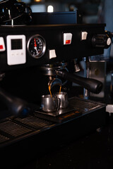 Close-up of Espresso machine making coffee in pub, bar, restaurant. Professional coffee brewing. Coffee Shop Cafeteria Restaurant Service Concept.