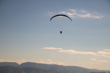 glider paragliding g against blue sky flying  adrenaline and freedom concept