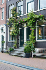 Fototapeta na wymiar porch and window with flowers in summer Amsterdam 