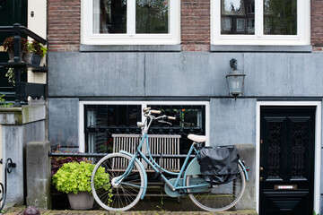 bicycle in front of a house in Amsterdam