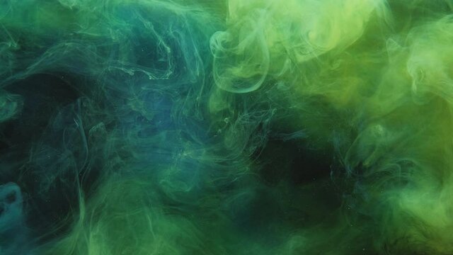 Color smoke background. Toxic fume. Chemical explosion. Vapor animation. Green blue yellow mist cloud mix motion on dark logo reveal layer.