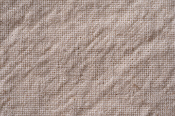 Close-up of beige fabric made of linen