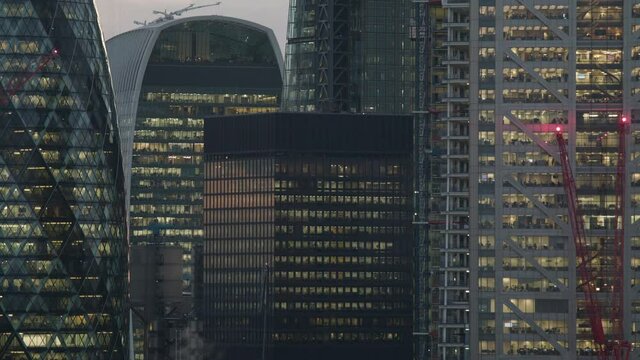 Office buildings in London at sunset in a time lapse.