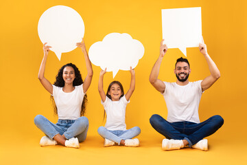 Arabic Family With Kid Holding Speech Bubbles Above Heads, Studio