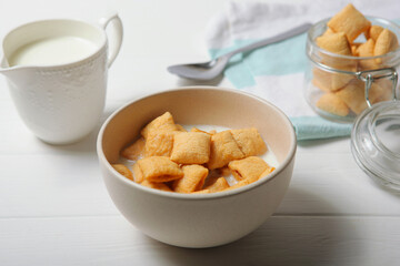 Corn pads with milk for breakfast on the table close-up