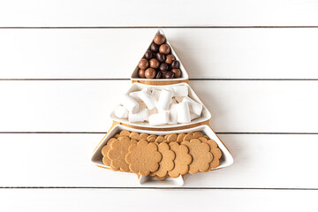 Sweet treats on a Christmas-tree-shaped sectional plate