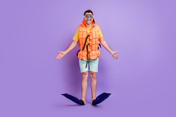 Full body photo of young man happy positive smile diver vacation swim isolated over violet color background