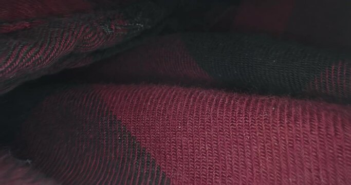 Flying inside a plaid checkered textile material with macro probe lens.