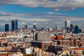 Fototapeta na wymiar Madrid, Spain- October 5, 2021: Panoramic view of the Cuatro Torres and the Kio towers of Madrid. Skile from Madrid. Financial zone