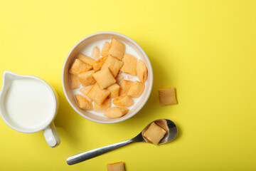 Corn pads with milk for breakfast on the table close-up
