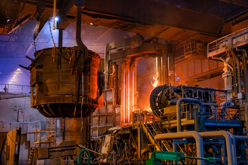 The metallurgical bucket hangs on a special crane beam