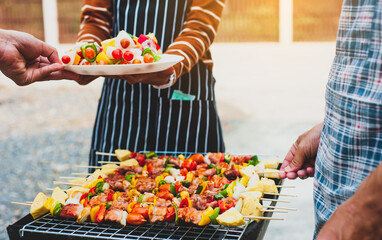 Chef grilling delicious barbecue on the charcoal grill.
