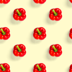 seamless pattern of bulgarian red pepper on yellow background. paprika wallpaper, sweet pepper print pattern, top view, flat layout, isolated.