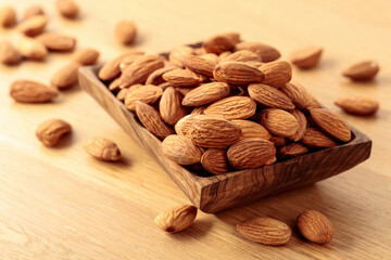 Almonds in a wooden dish.