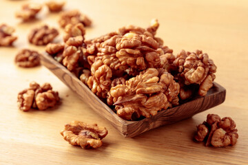 Walnuts in a old wooden dish.