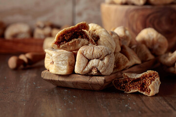 Dried figs in a wooden dish.