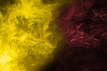 Yellow and pink steam on a black background.