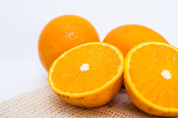 Oranges on white background, oranges cut in half