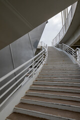 Ascent to the modern bridge for cars and pedestrians. The view from under the bridge.