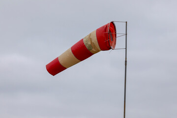 Windsock indicator of wind on runway airport. Wind cone indicating wind direction and force.