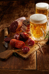 Serving for two with ice cold beers and cold meat selection