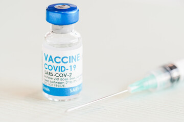 Covid-19 Corona Virus 2019-ncov vaccine vials medicine drug bottles syringe injection. Vaccination, immunization, treatment to cure Covid 19 Corona Virus infection. Healthcare And Medical concept.